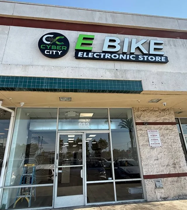 The Cyber City storefront in Fullerton: the round CC sign above the glass door of number 932